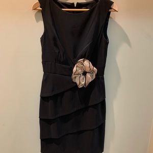 Black dress with gold bow.